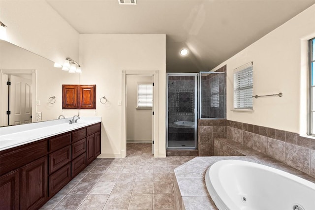 2908 Arbor Ct, Round Rock, TX 78681 - full bathroom with a whirlpool tub, a stall shower, double vanity, lofted ceiling, and tile patterned flooring