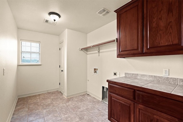 2908 Arbor Ct, Round Rock, TX 78681 - laundry room featuring hookup for an electric dryer, cabinet space, and washer hookup