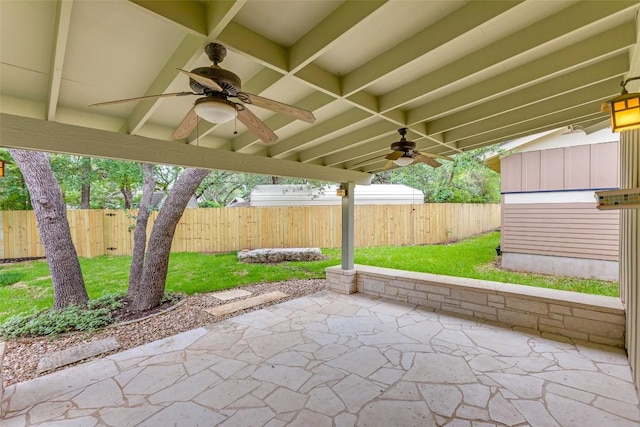 13604 Caldwell Dr Unit 72, Austin, TX 78750 - fenced backyard with ceiling fan and a patio area
