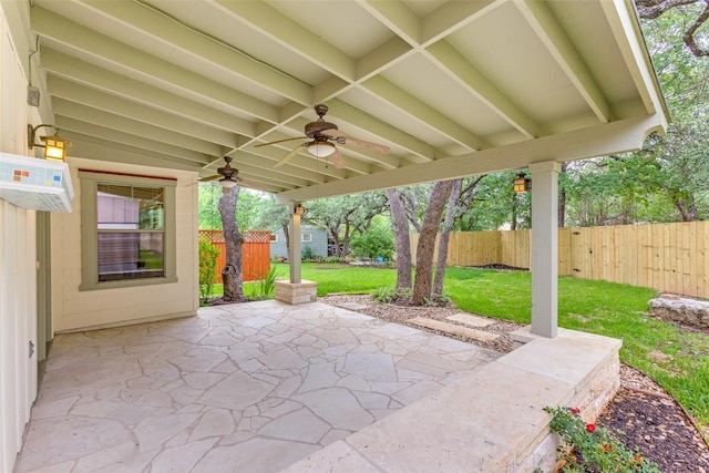13604 Caldwell Dr Unit 72, Austin, TX 78750 - fenced backyard with a ceiling fan, a patio area, and a wall mounted air conditioner