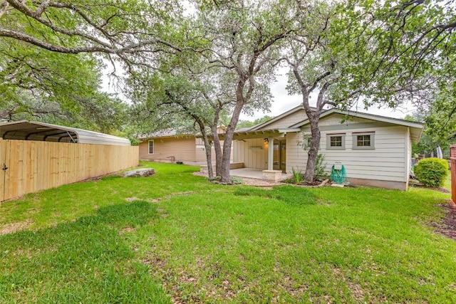 13604 Caldwell Dr Unit 72, Austin, TX 78750 - view of green lawn with a carport and a patio