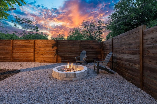 6406 Cannonleague Dr Unit 2, Austin, TX 78745 - patio terrace at dusk featuring a fire pit