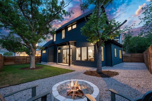 6406 Cannonleague Dr Unit 2, Austin, TX 78745 - rear view of house featuring a fire pit, a fenced backyard, and a patio