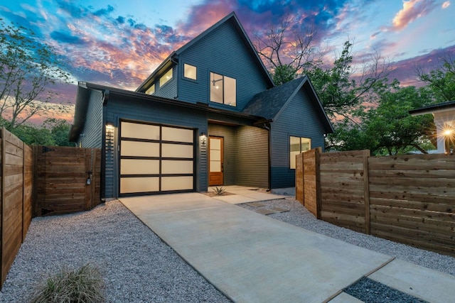 6406 Cannonleague Dr Unit 2, Austin, TX 78745 - contemporary home featuring driveway, an attached garage, and a gate