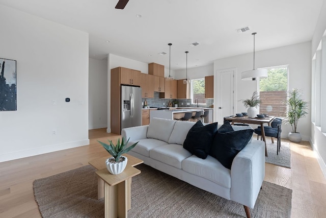 6406 Cannonleague Dr Unit 2, Austin, TX 78745 - living room with plenty of natural light, light wood finished floors, ceiling fan, and recessed lighting