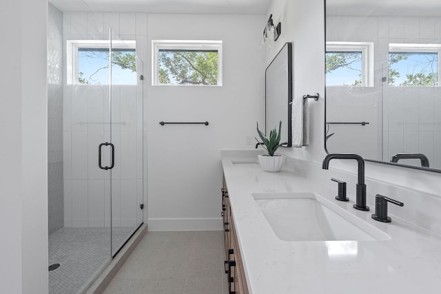 6406 Cannonleague Dr Unit 2, Austin, TX 78745 - bathroom featuring plenty of natural light, double vanity, a shower stall, and tile patterned floors