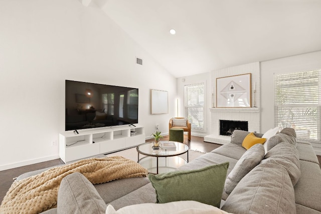 2709 Jorwoods Dr, Austin, TX 78745 - living room featuring high vaulted ceiling, a brick fireplace, and recessed lighting