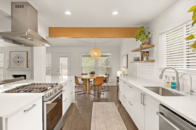 2709 Jorwoods Dr, Austin, TX 78745 - kitchen featuring extractor fan, gas stove, stainless steel dishwasher, white cabinetry, and decorative backsplash