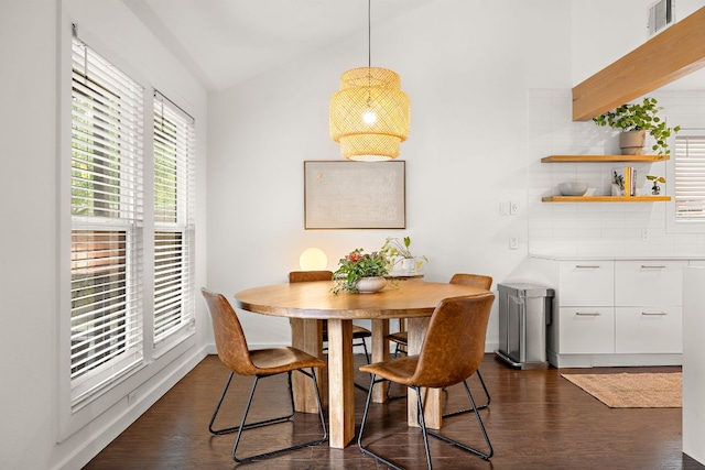 2709 Jorwoods Dr, Austin, TX 78745 - dining area featuring dark wood-style flooring and vaulted ceiling