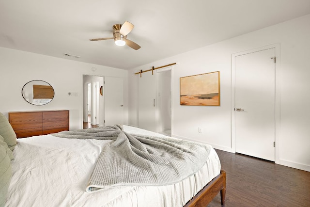 2709 Jorwoods Dr, Austin, TX 78745 - bedroom with dark wood finished floors and ceiling fan