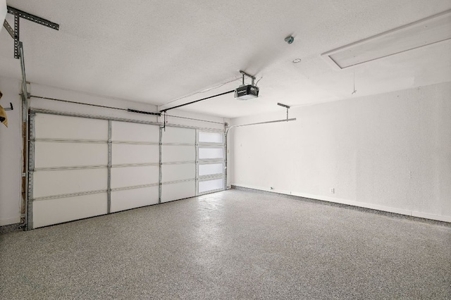2709 Jorwoods Dr, Austin, TX 78745 - garage with a garage door opener and baseboards