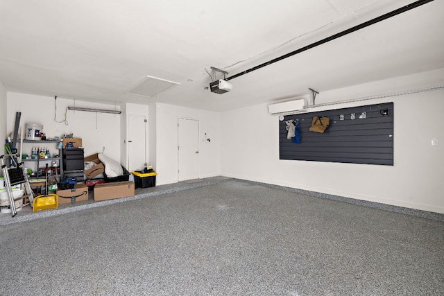 2709 Jorwoods Dr, Austin, TX 78745 - garage with an AC wall unit and a garage door opener