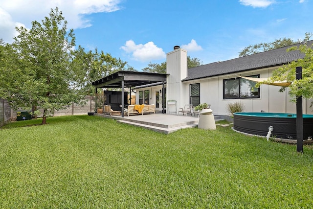 2709 Jorwoods Dr, Austin, TX 78745 - rear view of property featuring a chimney, an outdoor hangout area, a fenced backyard, a patio, and board and batten siding