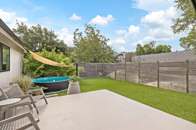 2709 Jorwoods Dr, Austin, TX 78745 - fenced backyard featuring a patio and a jacuzzi