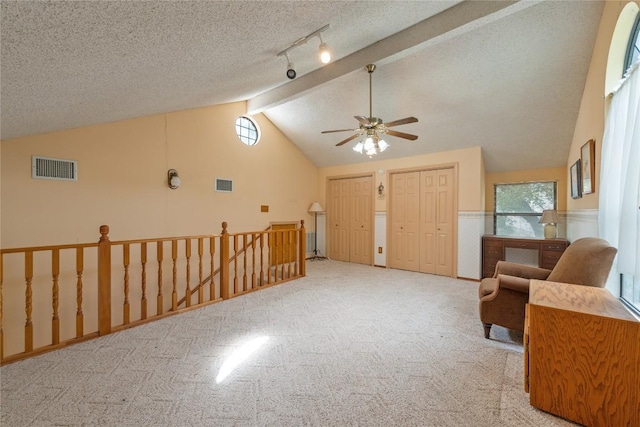 344 Fm 2984th Rd, Luling, TX 78648 - living area featuring ceiling fan, carpet floors, an upstairs landing, and a textured ceiling
