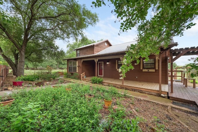 344 Fm 2984th Rd, Luling, TX 78648 - rear view of property with a metal roof and a wooden deck