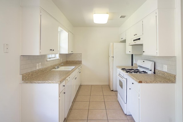 8204 Easter Cv, Austin, TX 78757 - kitchen with white appliances, extractor fan, decorative backsplash, light countertops, and white cabinetry