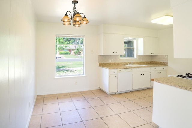 8204 Easter Cv, Austin, TX 78757 - kitchen with dishwasher, decorative backsplash, light countertops, and a chandelier