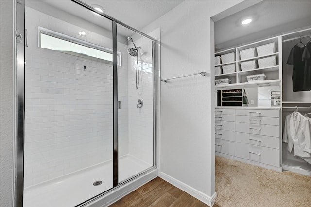 3032 Maryanne Ln, Pflugerville, TX 78660 - bathroom featuring a stall shower and wood finished floors