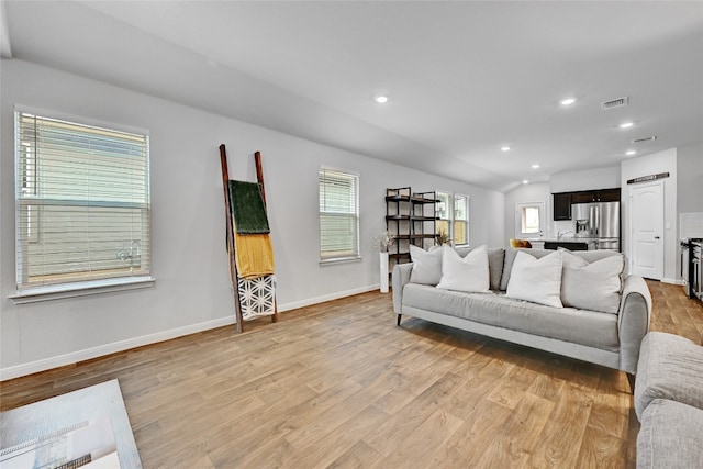 3032 Maryanne Ln, Pflugerville, TX 78660 - living room with light wood-style flooring, recessed lighting, and lofted ceiling