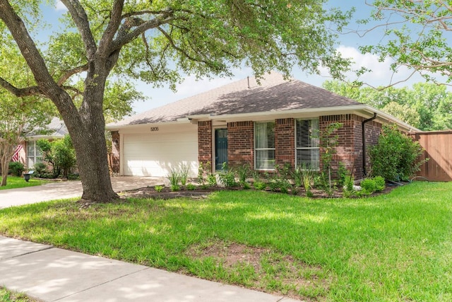 5205 Encinitas Ln, Austin, TX 78749 - ranch-style house featuring brick siding, concrete driveway, an attached garage, and a shingled roof