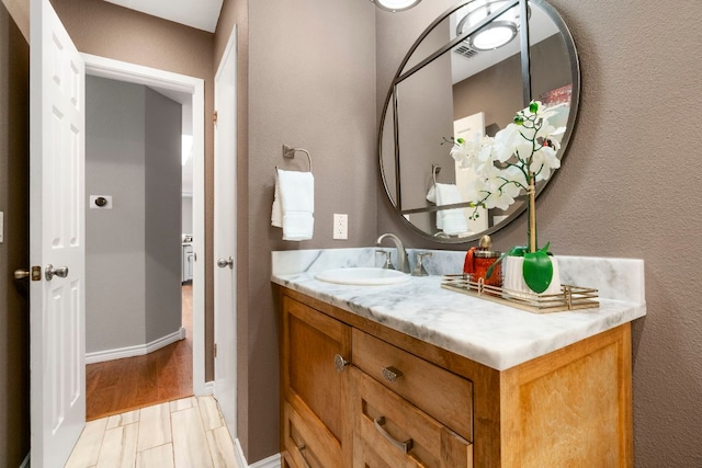 5205 Encinitas Ln, Austin, TX 78749 - bathroom with vanity and baseboards