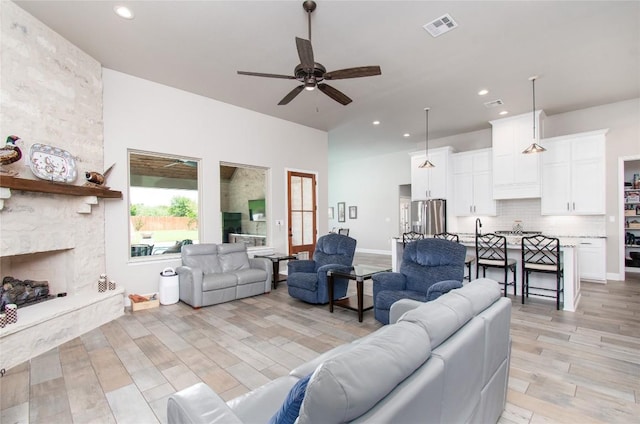 2050 Chalk Mill Xing, Salado, TX 76571 - living area with ceiling fan, light wood finished floors, recessed lighting, and a fireplace