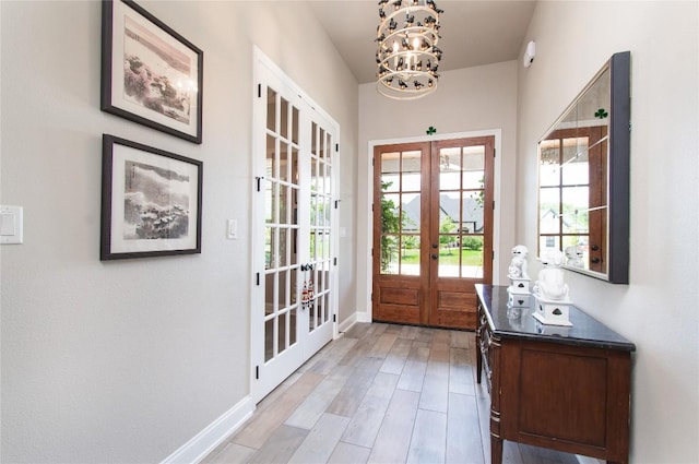 2050 Chalk Mill Xing, Salado, TX 76571 - doorway with french doors, a chandelier, and light wood-style flooring