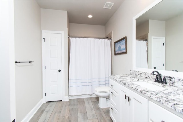 2050 Chalk Mill Xing, Salado, TX 76571 - bathroom featuring vanity, wood finished floors, curtained shower, and recessed lighting