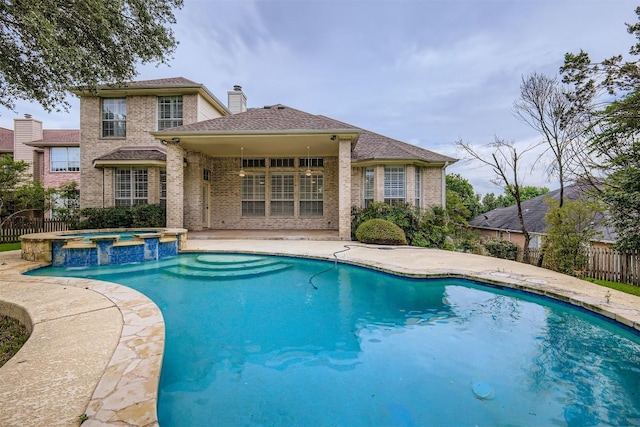 2114 Cliffs Edge Dr, Austin, TX 78733 - view of swimming pool with a pool with connected hot tub and a patio