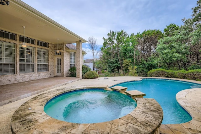 2114 Cliffs Edge Dr, Austin, TX 78733 - view of swimming pool with a pool with connected hot tub and a patio area