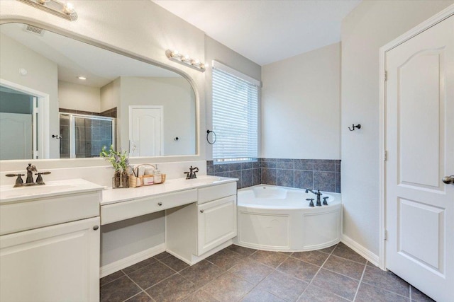 1604 Hughes Dr, Cedar Park, TX 78613 - full bathroom with double vanity, a stall shower, a bath, and tile patterned flooring