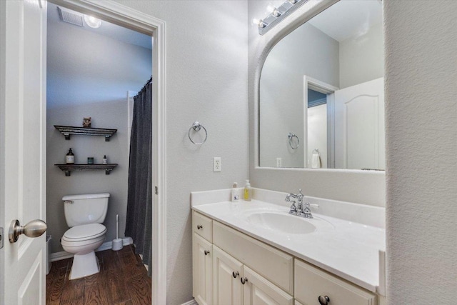 1604 Hughes Dr, Cedar Park, TX 78613 - full bathroom featuring vanity, wood finished floors, and a textured wall
