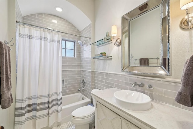 128 Squires Dr, Lakeway, TX 78734 - bathroom featuring vanity, shower / tub combo with curtain, and tile walls