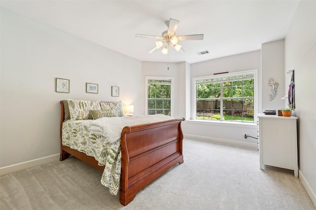 128 Squires Dr, Lakeway, TX 78734 - carpeted bedroom featuring baseboards and ceiling fan