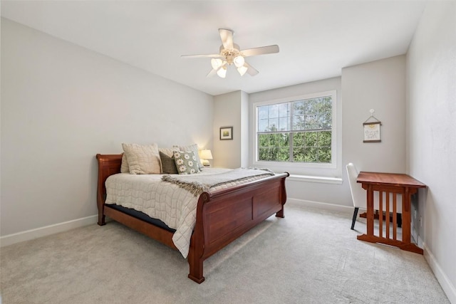 128 Squires Dr, Lakeway, TX 78734 - bedroom with light colored carpet and ceiling fan
