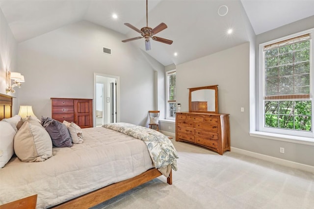 128 Squires Dr, Lakeway, TX 78734 - bedroom with multiple windows, recessed lighting, light colored carpet, ceiling fan, and high vaulted ceiling