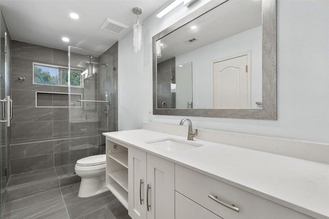 7601 Crackling Creek Dr, Austin, TX 78736 - full bathroom featuring vanity, a stall shower, marble look tiles, and recessed lighting