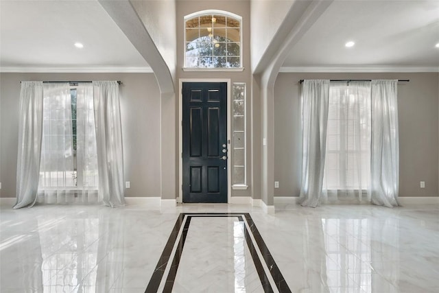 7601 Crackling Creek Dr, Austin, TX 78736 - foyer featuring arched walkways, marble tiled flooring, ornamental molding, and recessed lighting