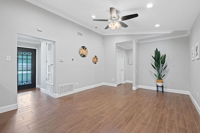 1101 Mahan Dr, Austin, TX 78721 - spare room featuring ceiling fan, recessed lighting, dark wood-style flooring, and crown molding