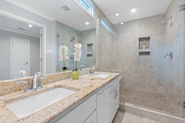 1101 Mahan Dr, Austin, TX 78721 - full bath with a tile shower, double vanity, ornamental molding, tile patterned floors, and recessed lighting