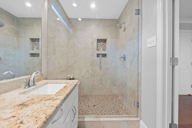 1101 Mahan Dr, Austin, TX 78721 - full bathroom featuring a shower stall, vanity, and recessed lighting