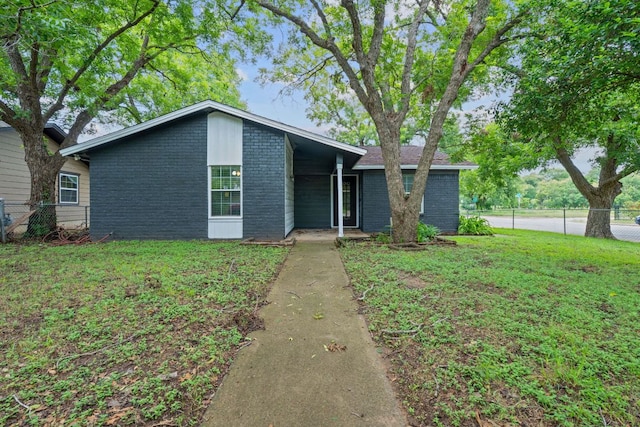 1101 Mahan Dr, Austin, TX 78721 - mid-century modern home with brick siding