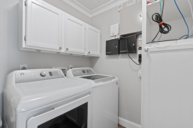 1101 Mahan Dr, Austin, TX 78721 - washroom featuring cabinet space, washing machine and dryer, and crown molding