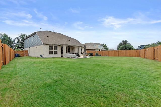 7104 Brick Slope Path, Austin, TX 78744 - back of property with a hot tub, a fenced backyard, a shingled roof, and a patio area