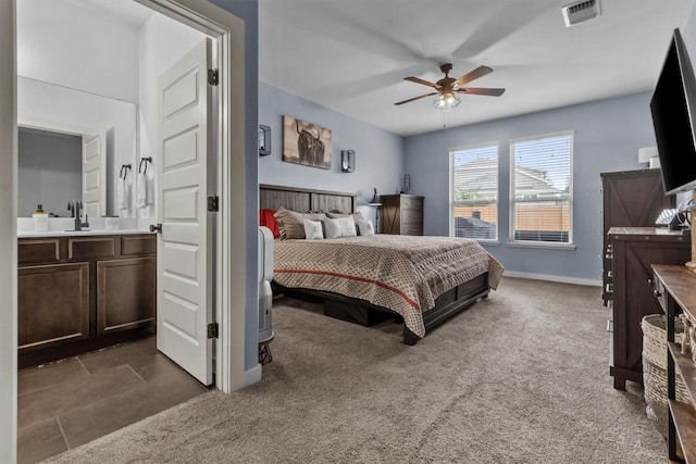 7104 Brick Slope Path, Austin, TX 78744 - bedroom with carpet, ensuite bath, and a ceiling fan