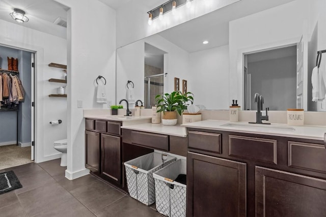 7104 Brick Slope Path, Austin, TX 78744 - bathroom with a shower stall, double vanity, and tile patterned flooring