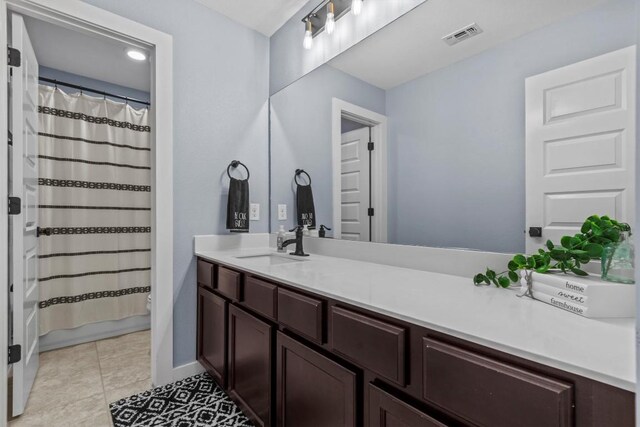 7104 Brick Slope Path, Austin, TX 78744 - bathroom featuring vanity, a shower with curtain, and tile patterned floors