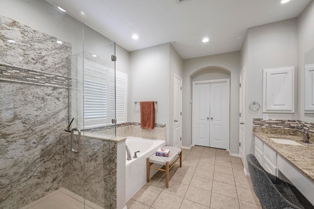 3612 Short Horn Ln, Round Rock, TX 78665 - bathroom featuring a garden tub, a stall shower, vanity, tile patterned floors, and recessed lighting