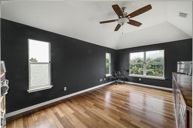 3612 Short Horn Ln, Round Rock, TX 78665 - empty room with wood finished floors, ceiling fan, and lofted ceiling